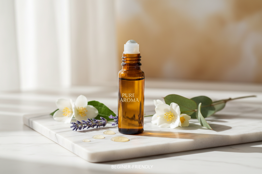 Dawam amber glass perfume oil roller bottle on a white marble tray with fresh jasmine and lavender accents.